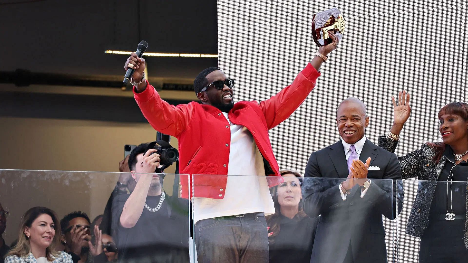 New York Mayor Eric Adams (R) presents Sean "Diddy" Combs with the keys to the city in Times Square (Image via Getty)